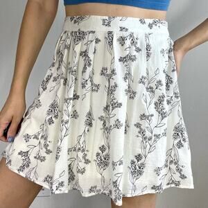 Old Navy off white mini skirt with black foliage outline